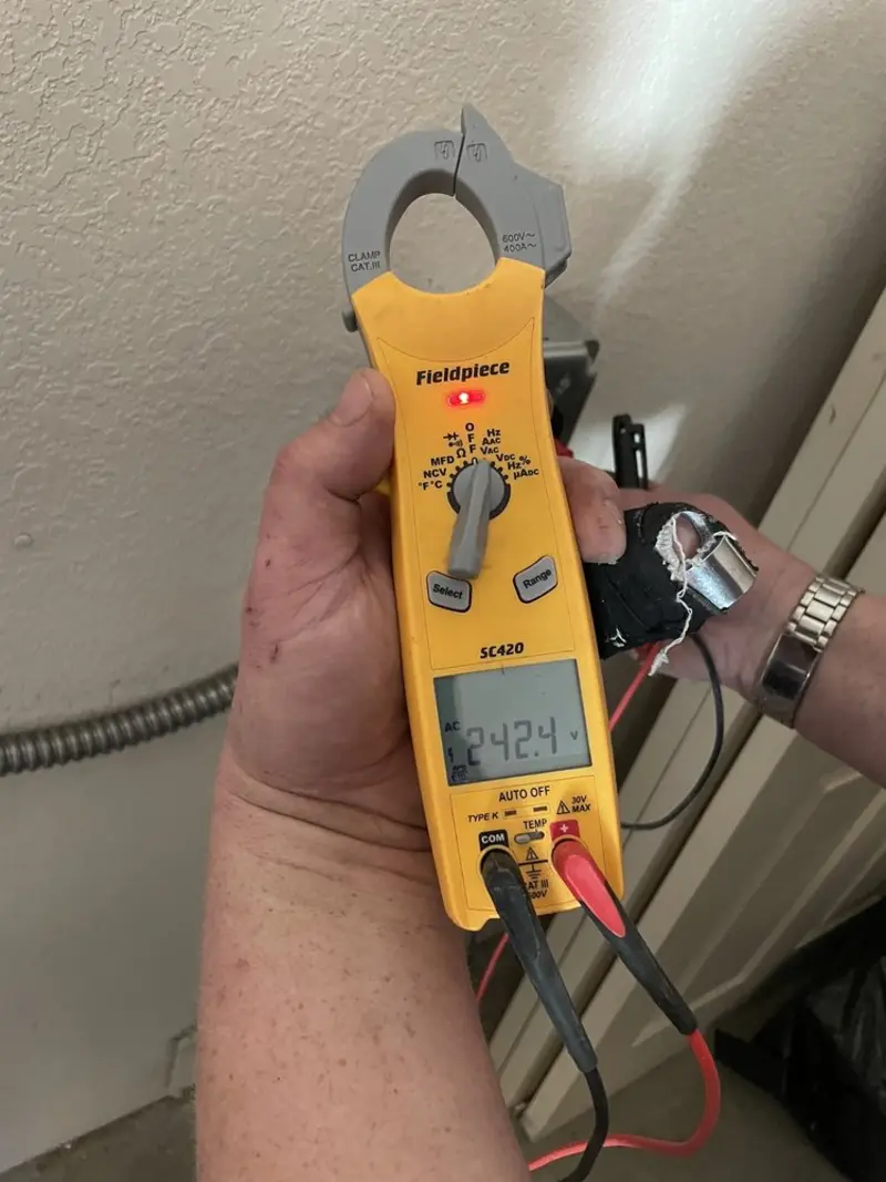 Voltage testing with clamp meter during Outlet Installation in Ulster